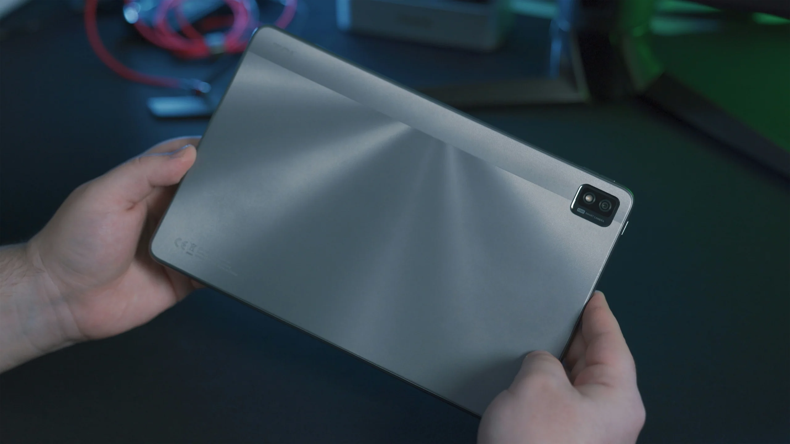 About 2 A technical person holding a tablet